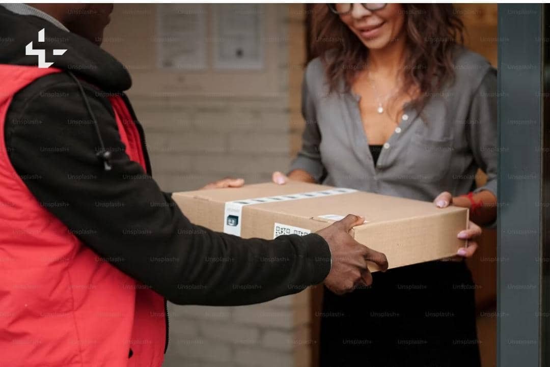 A courier delivering a package to a customer
